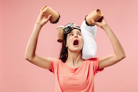 Tired happy woman drinking coffee at home or office having too much work. Bored businesswoman with...