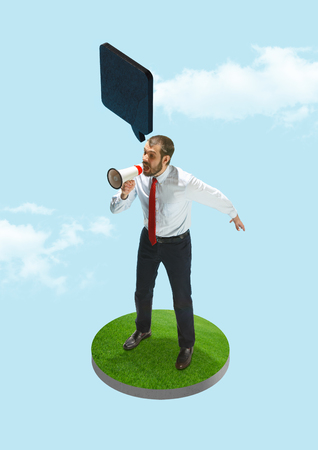 Business man screaming with a megaphone on blue sky background. Business processes, message, speaker, communication conceptの写真素材