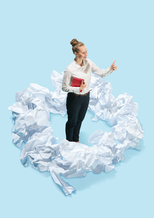 Concept of a new idea. A woman with crumpled pieces of paper. Flat isometric view of businesswoman. Conceptual collage. Business processes, creativity, solution concepts.の写真素材