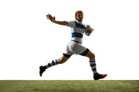The silhouette of one caucasian rugby man player isolated on white background. Studio shot of fit man in motion or movement with ball. Jump and action concept. An incredible strain of all forces.の写真素材