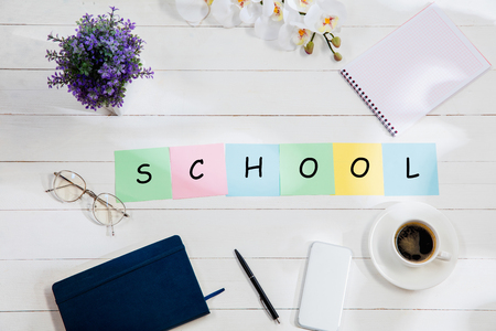 Stationery and word SCHOOL made of letters on wooden background. Education, college, school, stress, university, student, studying concept. Flat lay or top viewの写真素材