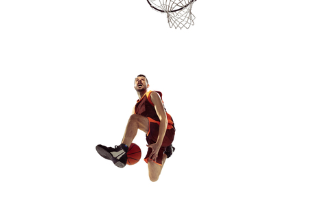Full length portrait of a basketball player with ball isolated on white background. Advertising...