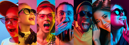 Beautiful male and female front portrait isolated on multicolored neon light backgroud. Young,...