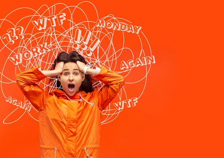 Young caucasian woman with mixed thoughts against bright orange studio background. Negative space....