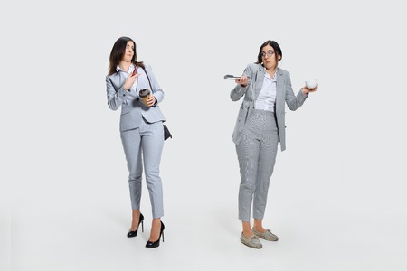 Look at yourself. Young woman comes to work rumpled and untidy because its deadline. Colleague in...