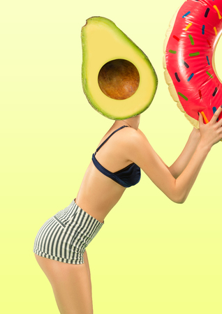 Female body with swim ring headed by a juicy avocado against green background. Negative space to insert your text. Modern design. Contemporary art collage. Vacation, summer, resort.の写真素材