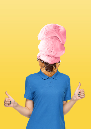 Female body in blue shirt headed by a strawberry icecream with chocolate on yellow background. Negative space to insert your text. Modern design. Contemporary art collage. Vacation, summer, resort.の写真素材