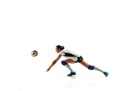 Young female volleyball player isolated on white studioの写真素材