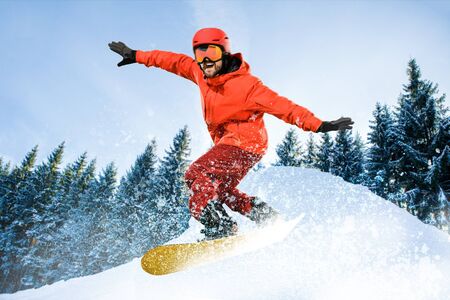 Young male model and winter sport, skiing against white alps mountains. Man amd woman in...