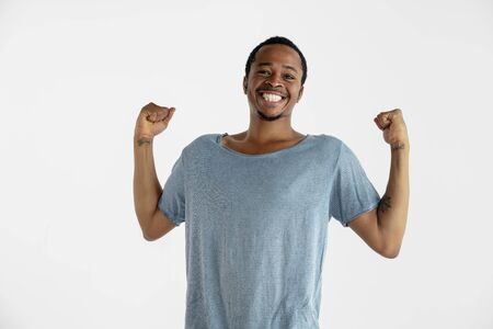 Beautiful male half-length portrait isolated on white studioの写真素材