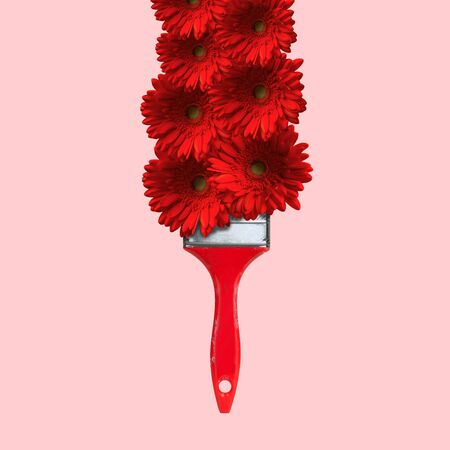 That's the art of nature. Tassel drawing and painting with bright red flowers as a paint on coral background. Negative space to insert your text. Modern design. Contemporary art collage.の写真素材