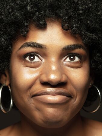 Close up portrait of young, emotional african-american woman. Highly detail photoshot of female...