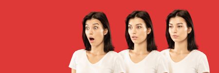 Caucasian young womans close up portrait on red studio background. Concept of human emotions, facial...