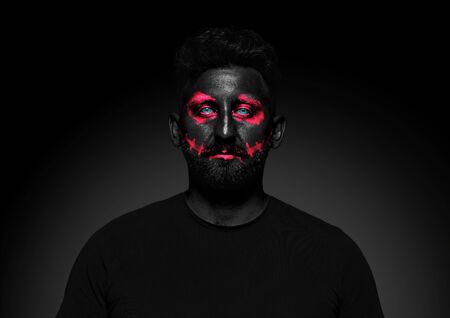 Discover whats inside you. Close up portrait of young man isolated on black studio background....