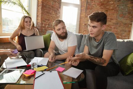 Group of young caucasian office workers meeting to discuss new ideasの写真素材