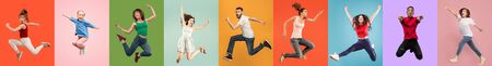 Young emotional people on multicolored backgrounds. Young surprised women jumping happy. Human emotions, facial expression concept, modern technologies. Trendy colors in collage. Made of 7 models.の写真素材