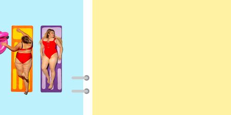 Top view of young caucasian model's resting on beach resort on blue and yellow background as an ocean and sand in bright swimsuit. Copyspace. Concept of summertime, party, chill, vacation, friendshipの写真素材