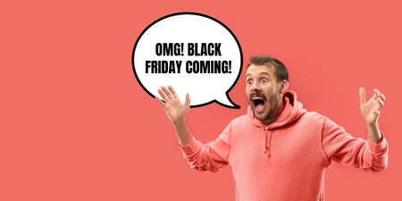 Half-length close up portrait of young man on coral background. The human emotions, black friday,...
