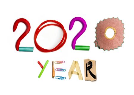 2020 made from numbers of colorful bright stationery on white studio background. New Year's and...