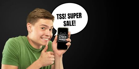 Portrait of man with speech bubble on black studio background. Copyspace for your advertising. Black...
