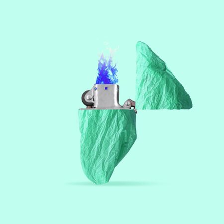 Glacier as a white lighter on green background. Copyspace. Modern design. Contemporary colorful and conceptual bright art collage. Global warming, environmental and eco saving, plastic pollution concept.の写真素材