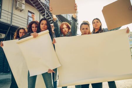 Young people protesting of womens rights and equality on the street. Caucasian women have meeting...