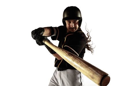 Baseball player, pitcher in a black uniform practicing and training isolated on a white background....