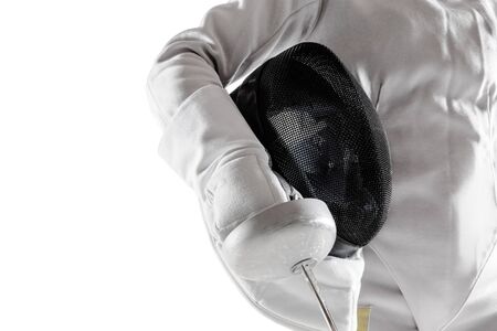 Close up of teen girl in fencing costume with sword in hand isolated on white studio background....