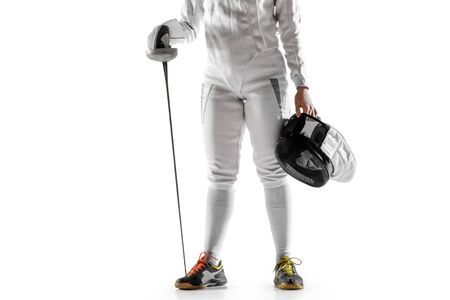 Close up of teen girl in fencing costume with sword in hand isolated on white studio background....