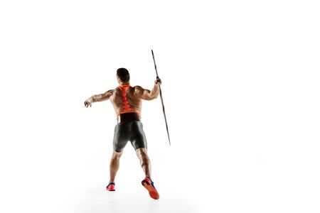 Male athlete practicing in throwing javelin isolated on white studio background. Professional sportsman training in motion, action. Concept of healthy lifestyle, movement, activity. Copyspace.の写真素材