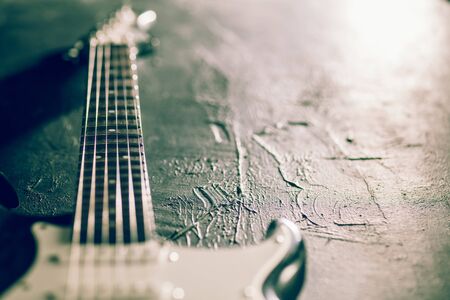 Sound. Professional guitar. Close up of old retro things shooted with vintage style colors and...