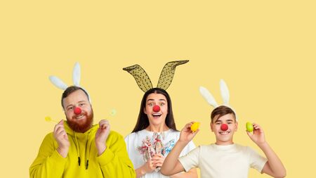 Collage of happy young people as a clowns celebrating red nose day. Male and female models on yellow...