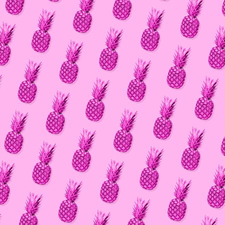 Pattern of bright pineapples on pink background. Copyspace to insert your text. Modern design. Contemporary artwork, collage. Concept of summertime, vacation, resort, mood, beach season.の写真素材