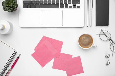 Coffee and eyewear. Flat lay mock-up. Feminine home office workspace, copyspace. Inspiring workplace for productivity. Concept of business, fashion, freelance, finance and artwork. Trendy pastel colors.の写真素材