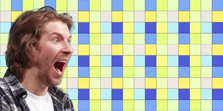 Crazy wondered. Caucasian beautiful mans portrait on mosaic tiles on the background. Concept of human emotions, facial expression, sales, ad, copyspace. New vision, bright modern artwork., design.の写真素材