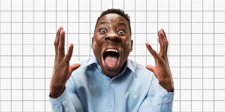 Astonished. African-american mans portrait on mosaic tiles on the background. Concept of human emotions, facial expression, sales, ad, copyspace. New vision, bright modern artwork., design.の写真素材