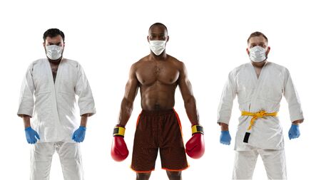 Beat the disease. Fighters and boxers in protective masks, gloves. Prevention of pneumonia respiratory symptoms such as fever, headache, cough. Chinese coronavirus. Healthcare, medicine, sport concept.の写真素材