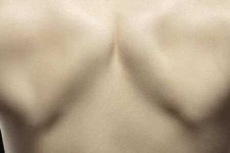 Spine. Detailed texture of human skin. Close up shot of young caucasian female body. Skincare,...