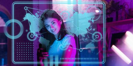 Woman using interface modern technology and digital layer effect as economics learning concept. Analyzing situation with worlds finance position while crisis and pandemic, business strategy.の写真素材