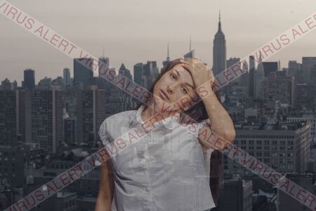 Stressed woman holding head with hands on abstract city, megapolis background. Double exposure....