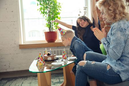 Happy. Mother, son and sister at home having fun. Holidays, family, comfort, cozy concept,...