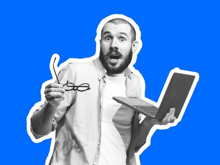 Astonished, with laptop. Collage in magazine style with emotional man in black and white contour on bright background with copyspace. Modern design, creative artwork, style and human emotions concept.の写真素材