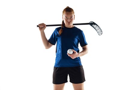 Floorball female player isolated on white studio background. Action and motion, movement, healthy...