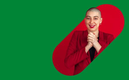 Portrait of young woman with freaky look on bright bicolor background with geometric style. Beautiful female model happy. Human emotions, facial expression, sales, ad concept. Artwork, design.の写真素材