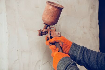 Closeup of professional builder working using construction equipment.の写真素材