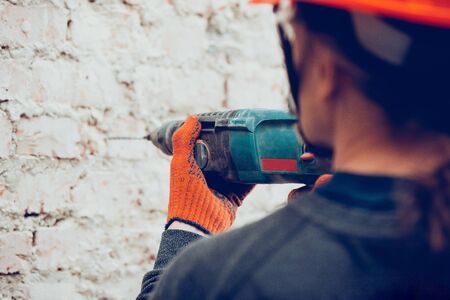Professional builder working using construction equipment.の写真素材