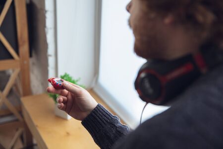 A man playing with retro toy