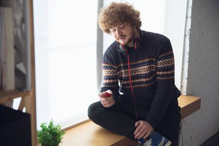 A man playing with retro toy