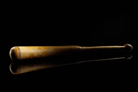 Baseball bat. Professional sport equipment isolated on black studio background. Concept of sport,...