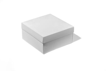 Blank white box isolated on a white studio background, copyspace for advertising. Ready for your graphics. Shopping, shipping, packing, delivery. Paperboard, cardboard for transportation and recycling.の写真素材
